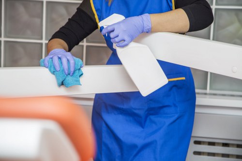 Local cleaner treating sofa stains in a Stjohnswood property